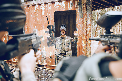 Image of Paintball, man surrender with soldier and gun, battlefield and fitness with military mission and lose game. Sport, camouflage and army outdoor with loss, player caught and aim at target with war