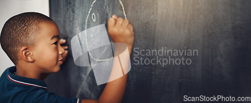 Image of School, chalk and boy drawing on a board for child development, creativity and art for learning. Academic, creative and young kid student writing on a blackboard in the classroom with mockup space.