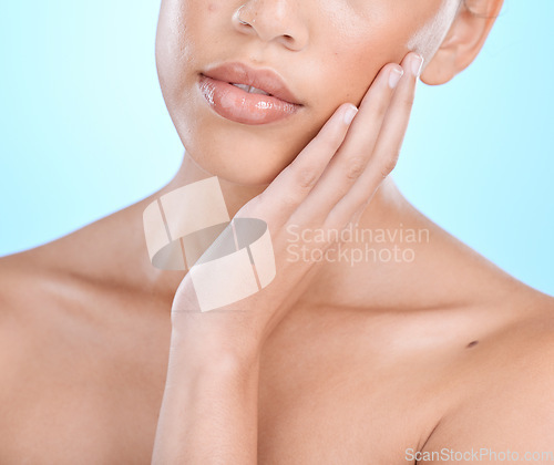 Image of Closeup, woman and skincare for beauty, dermatology and female on blue studio background. Zoom, girl or lady with cosmetics, natural care or morning routine for grooming, salon treatment or soft skin