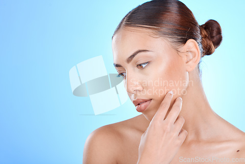 Image of Skincare, beauty and woman in studio for face, wellness and cosmetics grooming on blue background. Skin, facial and girl model relax in luxury, collagen and dermatology, self care or hygiene isolated