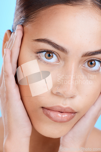 Image of Portrait, skincare or woman with dermatology, cosmetics or lady on blue studio background. Face detox, female or girl with makeup, morning routine or salon treatment with grooming, clear or soft skin