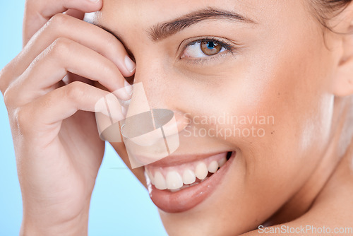 Image of Skincare, portrait and woman in studio for beauty, wellness and cosmetics grooming on blue background. Face, facial and girl model relax in luxury, collagen or dermatology, skin or routine isolated