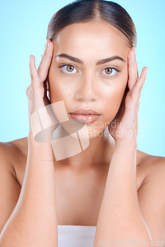 Image of Portrait, beauty and woman in studio for skincare, facelift and anti aging product on blue background. Face, botox and girl model relax with luxury, skin and facial, treatment and cosmetics isolated