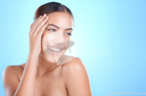 Image of Skincare, beauty and woman in studio for facial, wellness and cosmetics grooming on blue background. Skin, face and girl model relax in luxury, self love and dermatology, care and hygiene isolated