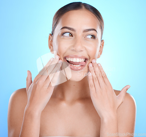 Image of Skincare, facial and woman in studio for beauty, wellness and cosmetics smile on blue background. Skin, glow and girl model relax in luxury, collagen and dermatology, self care or hygiene isolated