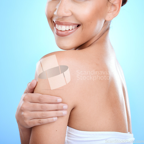 Image of Body, skin and woman in studio for skincare, wellness and hygiene on blue background. Arm, profile and girl model relax for beauty, luxury and grooming with cosmetics, self love and cleaning isolated