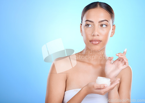 Image of Skincare, beauty and woman with cream jar for face, mockup space and advertising luxury skin care product promotion. Dermatology, natural spa cosmetics and facial, model isolated on blue background.