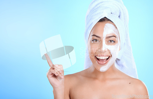 Image of Beauty, face mask portrait and woman with mockup space for dermatology cosmetics. Excited person pointing hand at spa skincare product for self care, skin glow and facial wellness on blue background