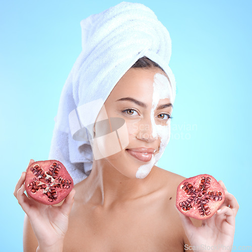 Image of Beauty, pomegranate and face mask portrait of woman natural dermatology skincare cosmetics. Aesthetic model person with sustainable fruit product for self care, skin glow and facial blue background