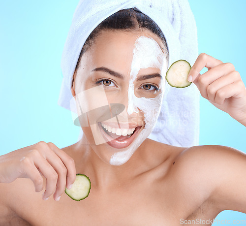 Image of Beauty, cucumber face mask and portrait of woman with vegetable for natural dermatology cosmetics. Aesthetic model person with spa facial advertising self care, glow and wellness on blue background