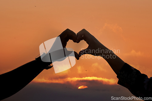 Image of Sunset, heart and hands of couple for love, trust and support on mockup, space pr sky background. Emoji, hand and people together for romance, celebration or valentines day date on nature copy space