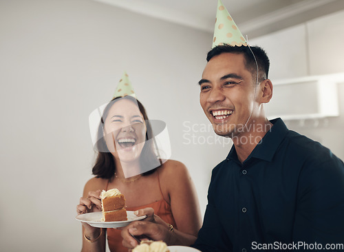 Image of Love, couple eating cake and birthday party with smile, loving and celebration for achievement and joyful. Romantic, man and woman with hats, dessert and laughing together in living room and cheerful