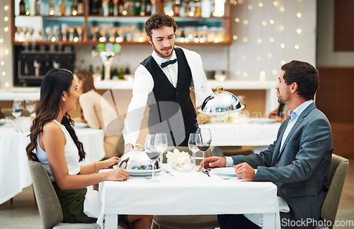 Image of Happy couple, restaurant server and fine dining food for valentines day date, love or romance in night. Man, woman and waiter with service, party and hospitality for dinner, bonding and celebration