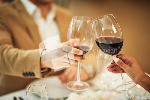 Image of Toast, wine and hands of couple in restaurant for romantic dinner, date and anniversary celebration. Relationship, fine dining and man and woman cheers together for social drinks, alcohol and relax