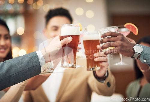 Image of Happy, celebration and friends toast with alcohol beer, cocktail or glass drinks for fun friendship reunion. Social party event, restaurant and excited group of people celebrate and cheers at a bar