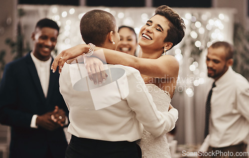 Image of Wedding, diversity and dance with a lesbian couple in celebration of their union together at a ceremony of tradition. LGBT, woman or love with a female and partner dancing after being married