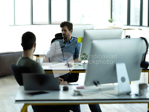 Image of Businessman, startup partnership and friends talk at desk with discussion, advice and conversation at workplace. Entrepreneur group, teamwork and chat in office for idea, planning and company goals