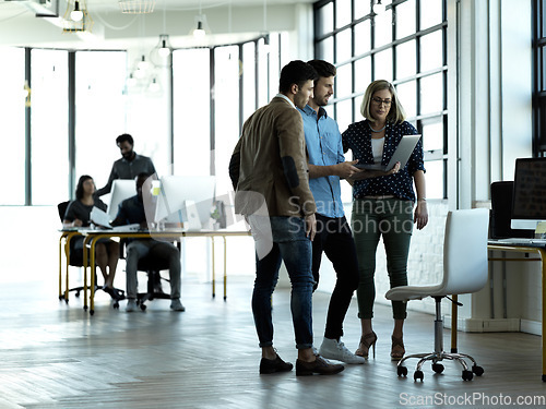 Image of Business people, laptop and conversation in modern office, planning and brainstorming for new project. Teamwork, staff and group with device, discussion and share ideas for website launch and email