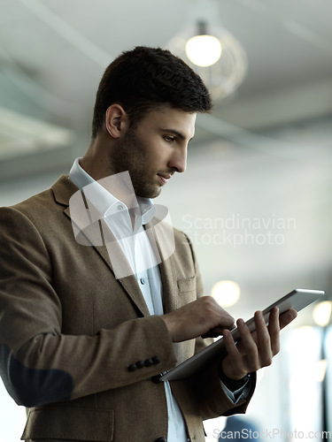 Image of Technology, internet and businessman with tablet reading email, sales or social media on web. Research, leadership and company ceo networking with online communication in management at startup office