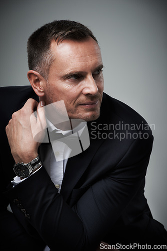 Image of Success, handsome and mature man in tuxedo and serious and isolated on grey background in studio. Luxury, glamour and wealth with cool celebrity actor style, elegant and sexy date for valentines day.