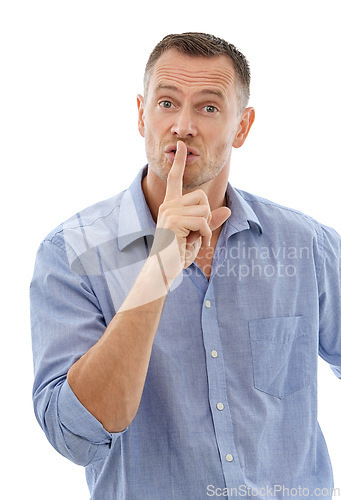 Image of Hush, secret and portrait of a man in a studio with a silence, quiet or whisper face expression. Person, handsome and mature male model with a finger on his mouth gesture isolated by white background