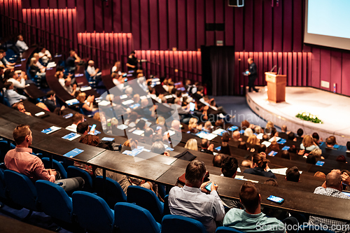 Image of Woman giving presentation on business conference event.