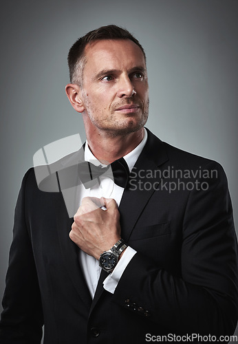 Image of Fashion, success and mature man in tuxedo, handsome online dating profile picture isolated on grey background in studio. Luxury, rich elegant celebrity actor style and date for valentines day.