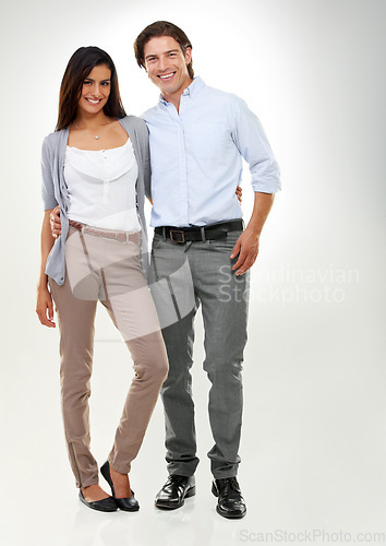 Image of Couple, love and people standing together looking happy, confident and excited isolated in studio white background. Portrait, man and woman in a relationship in happiness feeling content