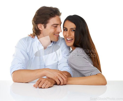 Image of Portrait, love and couple smile together in studio with white background and hand holding. Sitting, studio and face of a young man and woman from Israel in marriage with casual fashion and connection