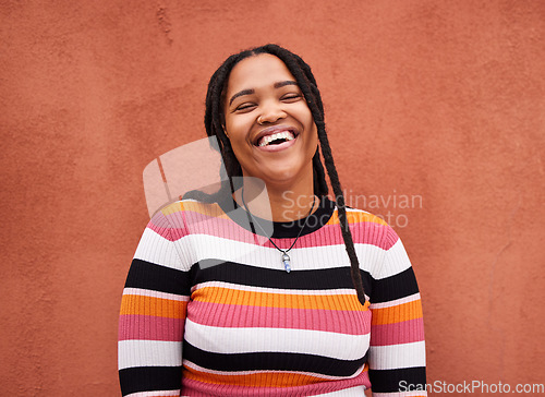 Image of Portrait, black woman and happiness on wall, casual outfit and freedom with laugh, trendy and smile. Face, Jamaican female and happy lady with trendy, relax and cool on break, adventure and cheerful