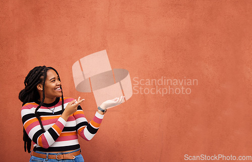 Image of Mockup, happy or black woman with marketing, product placement or branding space on wall background. Smile or African gen z girl advertising discount deal, sales offer or promotion announcement