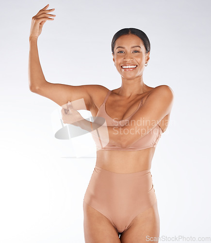 Image of Health, muscle flex and portrait of black woman on white background with smile, body wellness and beauty. Fitness, exercise and girl excited for weight loss, healthy lifestyle and progress in studio