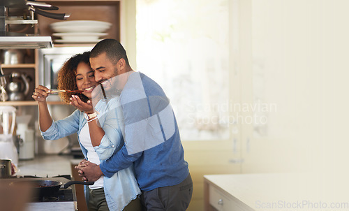 Image of Cooking, black couple and hug in a kitchen with marriage and love at home with mockup. Dinner, food taste and happy woman and man together with care in a house with mock up and happiness from eating