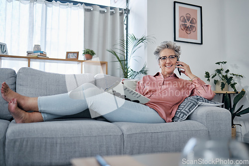 Image of Senior woman, sofa and phone call in home living room with smile, relax and newspaper for happy portrait. Retirement, smartphone communication and elderly lady on lounge couch for smile, chat or talk