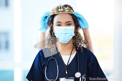 Image of Crown, face mask and portrait of a woman nurse with an award, achievement or promotion in the hospital. Success, healthcare and female doctor with tiara for celebration, motivation or gift in clinic.