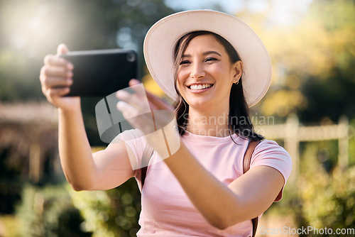 Image of Woman on holiday, smartphone and travel with selfie and adventure outdoor, happy and freedom in nature. Influencer with blog, content creation and phone photography, smile in picture and lifestyle