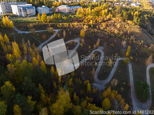 Image of Aerial top vew of winding road in the city