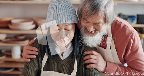 Image of Senior couple, hug and pottery studio work for clay sculpture, product manufacturing and mud design. Asian man, creative woman or retirement elderly in small business, workshop or Japanese art studio