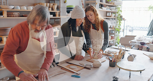 Image of Creative pottery class, senior couple and teacher working together. Art, creativity and education, retirement hobby with clay for asian man and woman from Japan in workshop with girl teaching craft.