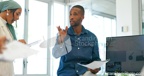 Image of Black businessman, mentor or diversity meeting on paper, documents or review in coaching or training feedback. Speaker, leadership or talking in workshop, collaboration or teamwork strategy planning