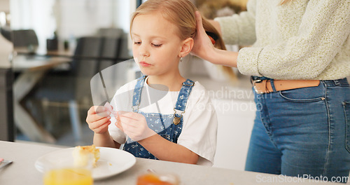 Image of Hair care, brush and kid with mother talking, play and relax in home kitchen during morning breakfast. Mom prepare for day, bonding time and child care for happy family youth girl with mamas love