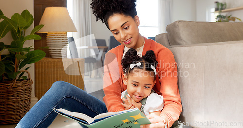 Image of Mother, child and reading education, learning and teaching with story book for kids in the home living room. Latino woman and child read book, literature or story while relax, smile or happy together