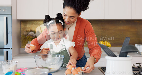 Image of Mother, child and baking with eggs in the kitchen for family bonding, learning and fun with ingredients at home. Happy mom teaching helpful kid to bake, cook or mix for recipe together at the house