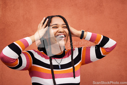 Image of Wall, black woman and thinking with joy, laughing and freedom with happiness, future and imagination. Jamaican, happy female and lady with smile, wonder and freedom on backdrop, trendy and fashion