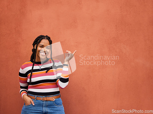 Image of Mockup, portrait or black woman with marketing, logo or branding space on orange wall background. Product placement or happy African girl advertising discount, sales offer or promotion announcement