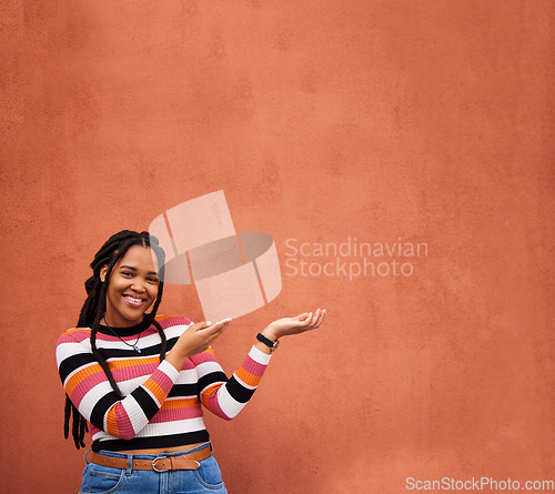 Image of Mockup, portrait or happy black woman with marketing, product placement or branding space on wall background. African gen z girl advertising discount deal news, sales offer or promotion announcement