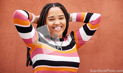 Image of Relax, happy and portrait of a black woman by a wall in the city while on a vacation with freedom. Adventure, smile and African female with a happiness, joyful and carefree mindset in town on holiday