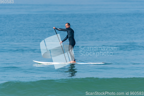 Image of Stand up paddle surfer