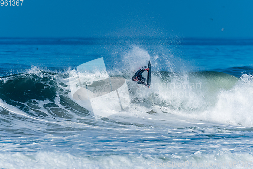 Image of Bodyboarder surfing ocean wave