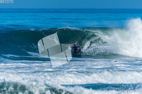 Image of Bodyboarder surfing ocean wave